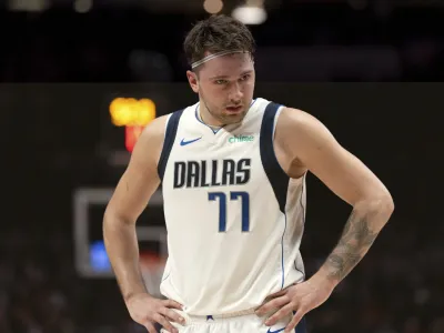Dallas Mavericks guard Luka Doncic looks to the sideline during the second half of the team's NBA basketball game against the Portland Trail Blazers on Friday, Dec. 8, 2023, in Portland, Ore. (AP Photo/Howard Lao)