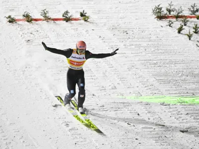 Karl Geiger of Germany in action, during the men's ski jumping FIS World Cup at the Titlisschanze, in Engelberg, Switzerland, Sunday, Dec. 19, 2021. (Gian Ehrenzeller/Keystone via AP)