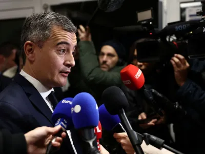 French Interior Minister Gerald Darmanin talks to journalists during a visit at a police station, a day after French lawmakers rejected his immigration bill, in Maisons-Alfort near Paris, France, December 12, 2023. REUTERS/Stephanie Lecocq