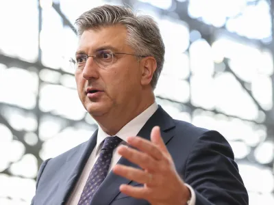 Croatia's Prime Minister Andrej Plenkovic talks to journalists during for the third EU-CELAC summit that brings together leaders of the EU and the Community of Latin American and Caribbean States, in Brussels, Belgium, Tuesday, July 18, 2023. (AP Photo/Francois Walschaerts)