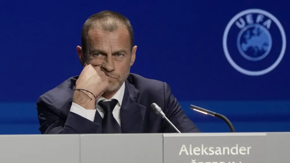 FILE - President of UEFA Aleksander Ceferin listens to questions during a news conference, after being reelected, at the end of the 47th ordinary UEFA congress in Lisbon, Wednesday, April 5, 2023. The European Union's top court has ruled UEFA and FIFA acted contrary to competition law by blocking plans for the breakaway Super League. The&nbsp;case was heard&nbsp;last year at the Court of Justice after Super League failed at launch in April 2021. UEFA President Aleksander Ceferin called the club leaders "snakes" and "liars." (AP Photo/Armando Franca, File)