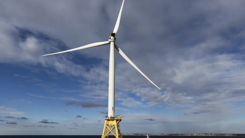 A Block Island Wind Farm turbine operates, Thursday, Dec. 7, 2023, off the coast of Block Island, R.I., during a tour organized by Orsted. (AP Photo/Julia Nikhinson)