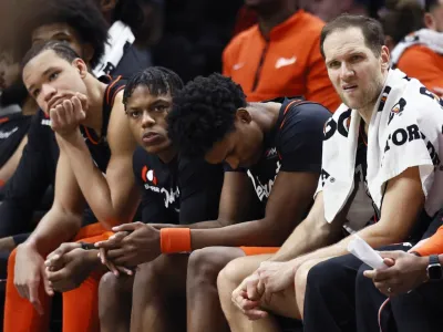 Detroit Pistons forward Kevin Knox II, from left, guard Marcus Sasser, forward Ausar Thompson and forward Bojan Bogdanovic sit on the bench during the fourth quarter of a 118-112 loss to the Brooklyn Nets, an NBA record 27th straight loss, Tuesday, Dec. 26, 2023, in Detroit. (AP Photo/Duane Burleson)