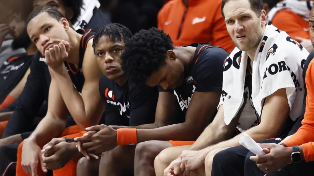 Detroit Pistons forward Kevin Knox II, from left, guard Marcus Sasser, forward Ausar Thompson and forward Bojan Bogdanovic sit on the bench during the fourth quarter of a 118-112 loss to the Brooklyn Nets, an NBA record 27th straight loss, Tuesday, Dec. 26, 2023, in Detroit. (AP Photo/Duane Burleson)