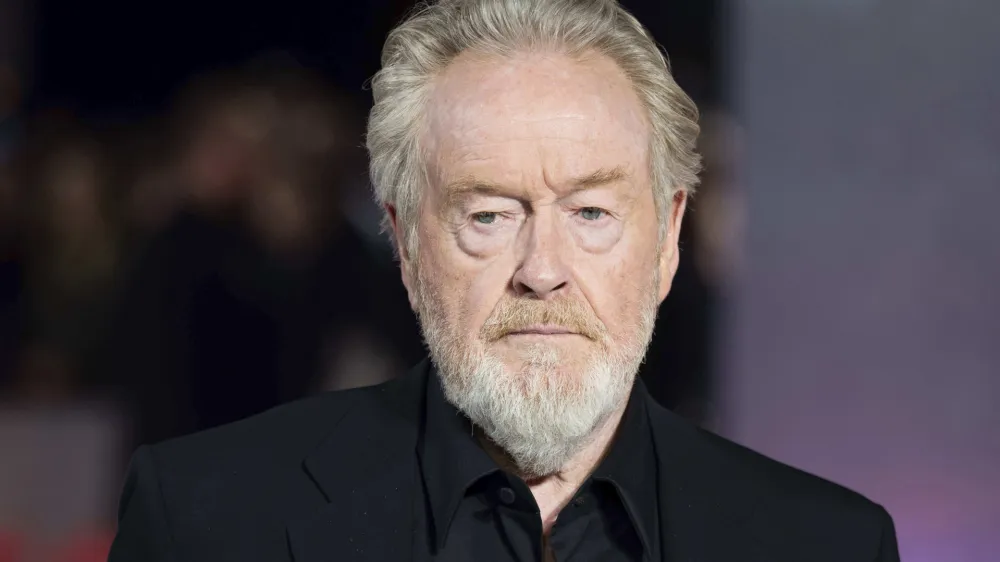 FILE - Ridley Scott poses for photographers upon arrival at the UK premiere of the film 'Napoleon' in London, Thursday, Nov. 15, 2023. Singer Shirley Bassey, director Ridley Scott and England goalkeeper Mary Earps were recognized Friday, Dec. 29, 2023 in the U.K.'s New Year Honors list, which celebrates the achievements and services of more than 1,000 people across the country. Other well-known names on the list include "The Great British Bake Off" judge Paul Hollywood, "Game of Thrones" actor Emilia Clarke, and Justin Welby, the Archbishop of Canterbury. (Photo by Scott Garfitt/Invision/AP, File)