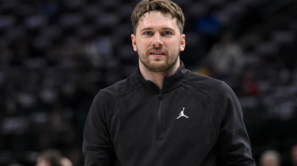Jan 3, 2024; Dallas, Texas, USA; Dallas Mavericks guard Luka Doncic (77) warms up before the game between the Dallas Mavericks and the Portland Trail Blazers at the American Airlines Center. Mandatory Credit: Jerome Miron-USA TODAY Sports