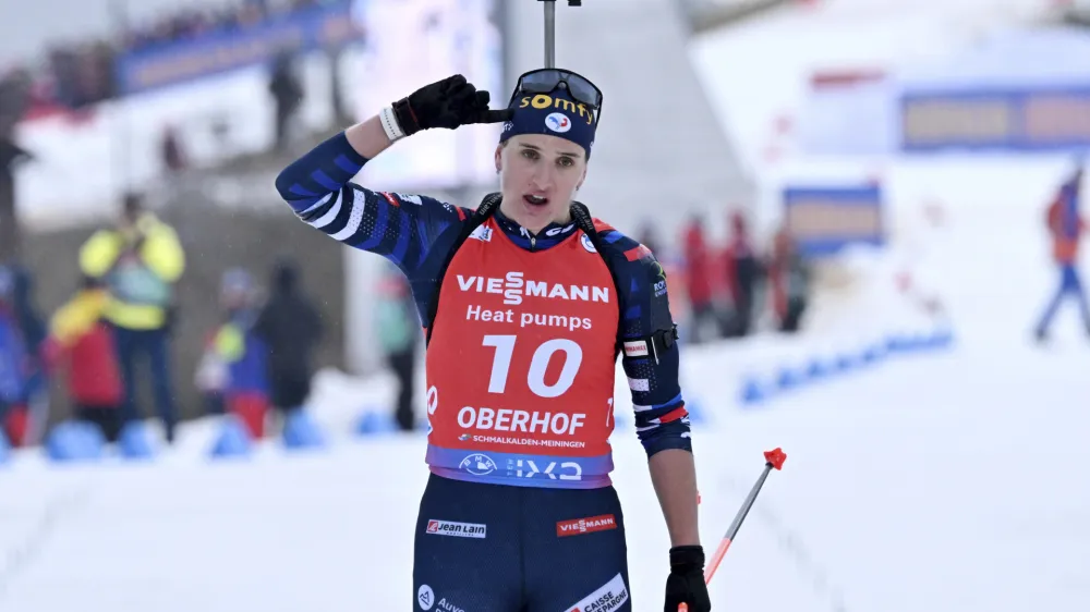 First placed Julia Simon from France celebrates after the women's 10km pursuit race of the Biathlon World Cup in Oberhof, Germany, Saturday, Jan. 6, 2024. (Martin Schutt/dpa via AP)