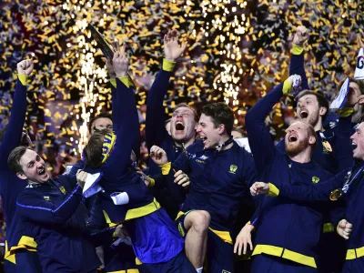 Swedish players celebrate their victory at the end of the Men's European Handball Championship final match between Sweden and Spain, in Budapest, Hungary, Sunday, Jan. 30, 2022. (AP Photo/Anna Szilagyi)