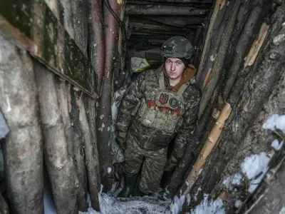 A Ukrainian serviceman of 2 battalion 92nd brigade with the call sign "Myron", 21, is seen inside a dugout, amid Russia's attack on Ukraine, at a position near Bakhmut in Donetsk region, Ukraine January 10, 2024. REUTERS/Inna Varenytsia