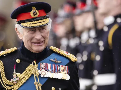 Britain's King Charles III inspects the 200th Royal Military Academy Sandhurst Sovereign's Parade and presents the new Colours and Sovereign's Banner to the receiving Ensigns in Camberley, England, Friday, April 14, 2023. (Dan Kitwood/Pool Photo via AP)