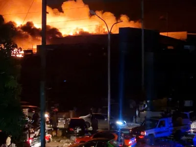 People take part in looting and arson during protests over a pay cut for police that officials blamed on an administrative glitch, in Port Moresby, Papua New Guinea January 10, 2024 in this screen grab obtained from social media video. Leo Manuai/via REUTERS THIS IMAGE HAS BEEN SUPPLIED BY A THIRD PARTY. MANDATORY CREDIT. NO RESALES. NO ARCHIVES.