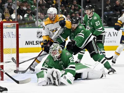 Jan 12, 2024; Dallas, Texas, USA; Dallas Stars goaltender Jake Oettinger (29) gives up a power play goal to Nashville Predators defenseman Roman Josi (not pictured) as center Colton Sissons (10) and defenseman Jani Hakanpaa (2) battle for position during the third period at the American Airlines Center. Mandatory Credit: Jerome Miron-USA TODAY Sports