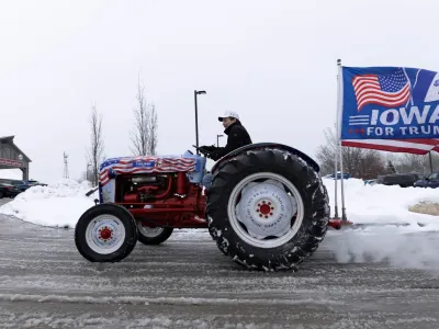 Gary Leffler, of West Des Moines, drives his tractor outside of the Machine Shed Restaurant during an event for Republican presidential candidate and former U.S. President Donald Trump in Urbandale, Iowa, U.S., January 11, 2024. REUTERS/Alyssa Pointer