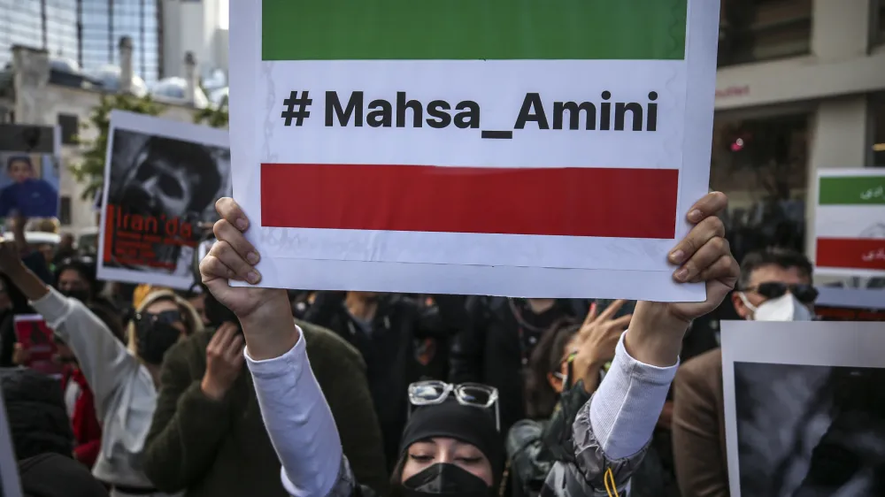 Iranian women gather to protest over the death of Mahsa Amini during a demonstration outside the Iranian consulate in Istanbul, Turkey, Monday, Oct. 17, 2022. Amini, a 22-year-old woman who had been detained by Iran's morality police in the capital of Tehran for allegedly not adhering to Iran's strict Islamic dress code, died while being in police custody. (AP Photo/Emrah Gurel)