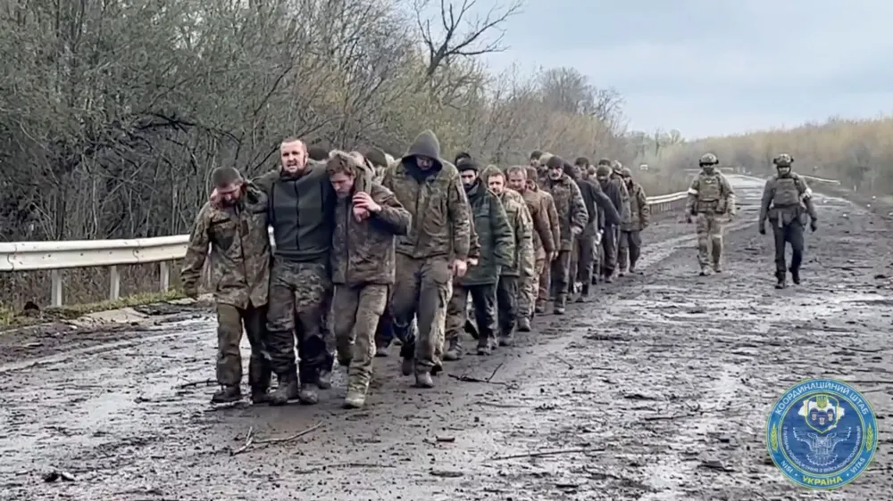 Ukrainian prisoners of war (POWs) are seen during a swap, amid Russia's attack on Ukraine, at an unknown location, Ukraine, in this screengrab taken from a handout video released April 16, 2023. Coordination Headquarters for the Treatment of Prisoners of War/Handout via REUTERS ATTENTION EDITORS - THIS IMAGE HAS BEEN SUPPLIED BY A THIRD PARTY. MANDATORY CREDIT.
