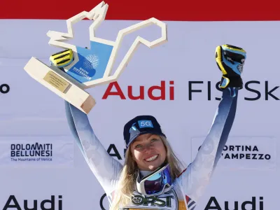 Norway's Ragnhild Mowinckel celebrates winning an alpine ski, women's World Cup downhill race, in Cortina d'Ampezzo, Italy, Saturday, Jan. 27, 2024. (AP Photo/Alessandro Trovati)
