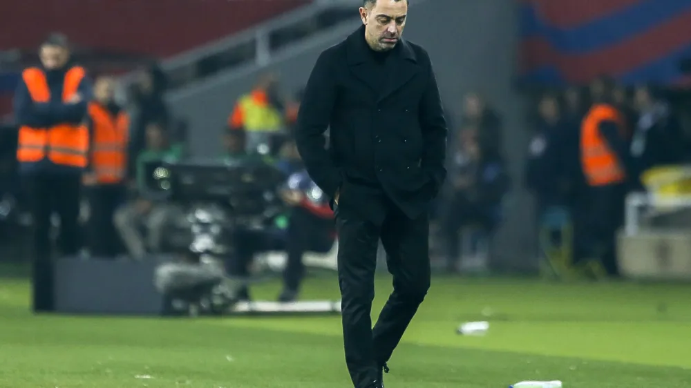 Barcelona's head coach Xavi Hernandez reacts during a Spanish La Liga soccer match between Barcelona and Villarreal at the Olimpic Lluis Companys stadium in Barcelona, Spain, Saturday, Jan. 27, 2024. Xavi says he won't continue as Barcelona's coach after this season. (AP Photo/Joan Monfort)