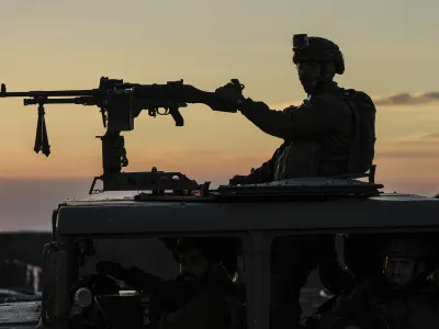 An Israeli soldier takes up position on the border with the Gaza Strip in southern Israel, Monday, Jan. 29, 2024. (AP Photo/Tsafrir Abayov)