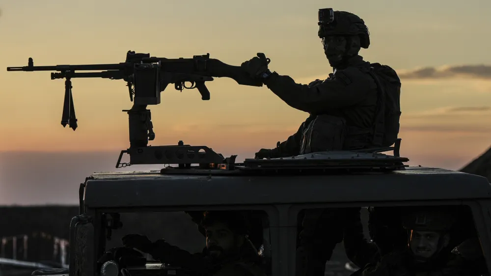 An Israeli soldier takes up position on the border with the Gaza Strip in southern Israel, Monday, Jan. 29, 2024. (AP Photo/Tsafrir Abayov)