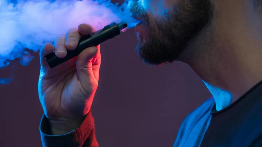 Vaping flavored e-liquid from an electronic cigarette