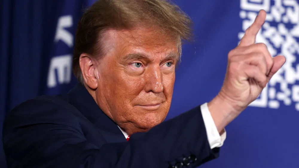 FILE PHOTO: Former U.S. President and Republican presidential candidate Donald Trump gestures as he attends a rally in advance of the New Hampshire primary election in Laconia, New Hampshire, U.S. January 22, 2024. REUTERS/Mike Segar/File Photo