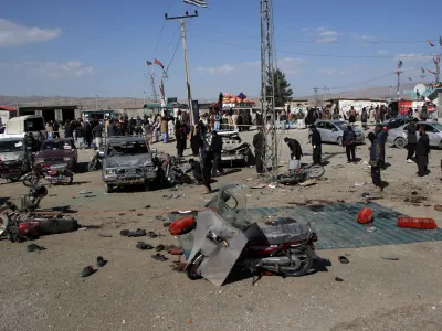 Members of a bomb disposal squad examine the site of a blast in Khanozai, Balochistan, Pakistan, February 7, 2024. REUTERS/Naseer Ahmed