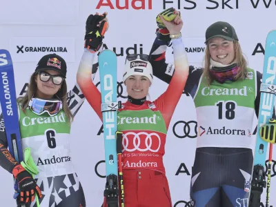 From left, second placed New Zealand's Alice Robinson, the winner Switzerland's Lara Gut Behrami and third placed United States' A.J. Hurt celebrate after an alpine ski, women's World Cup giant slalom race, in Soldeu, Andorra, Saturday, Feb. 10, 2024. (AP Photo/Marco Trovati)