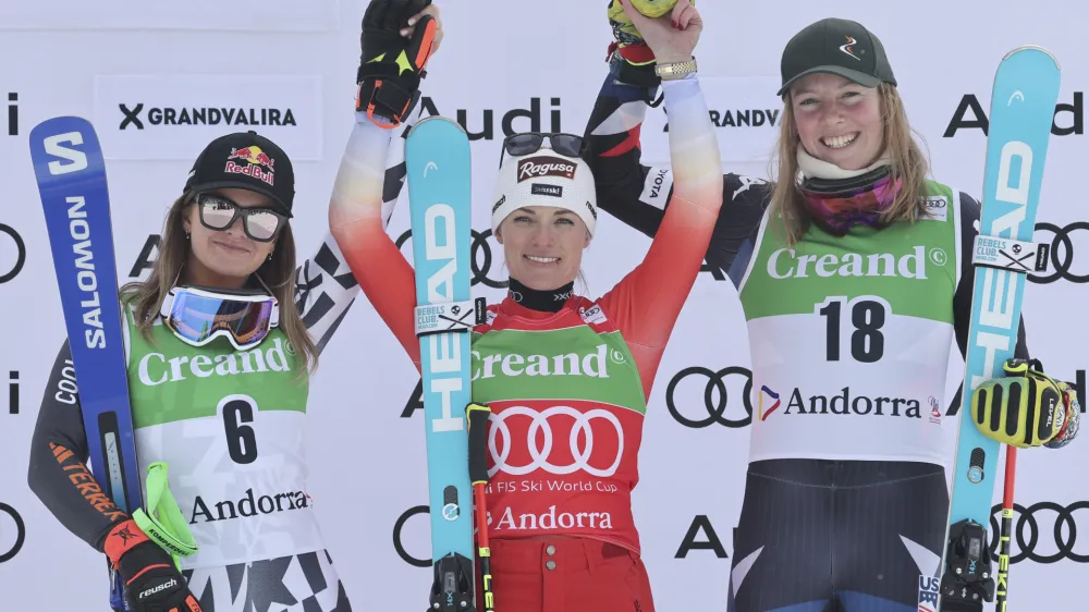 From left, second placed New Zealand's Alice Robinson, the winner Switzerland's Lara Gut Behrami and third placed United States' A.J. Hurt celebrate after an alpine ski, women's World Cup giant slalom race, in Soldeu, Andorra, Saturday, Feb. 10, 2024. (AP Photo/Marco Trovati)