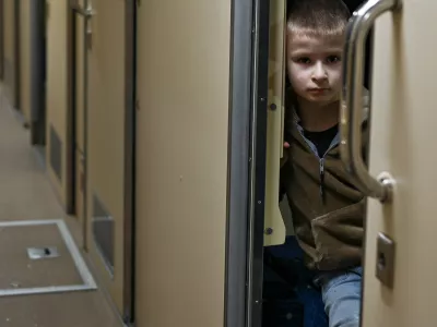 LVIV, UKRAINE - FEBRUARY 14, 2024 - A boy looks out of a compartment on the Train to Your retro train launched by Ukrainian Railways (Ukrzaliznytsia) to celebrate Valentine?s Day, Lviv, western Ukraine. (Photo by Anastasiia Smolienko/Ukrinform/Sipa USA)No Use Germany.