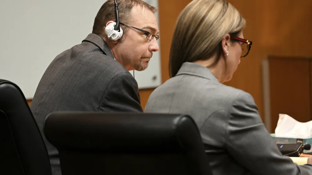 James Crumbley and his attorney Mariell Lehman listen to the verdict in Oakland County Court in Pontiac, Mich., Thursday, March 14, 2024. Crumbley, the father of a Michigan school shooter, was found guilty of involuntary manslaughter, a second conviction against the teen's parents who were accused of failing to secure a gun at home and doing nothing to address acute signs of his mental turmoil. (Robin Buckson/Detroit News via AP, Pool)
