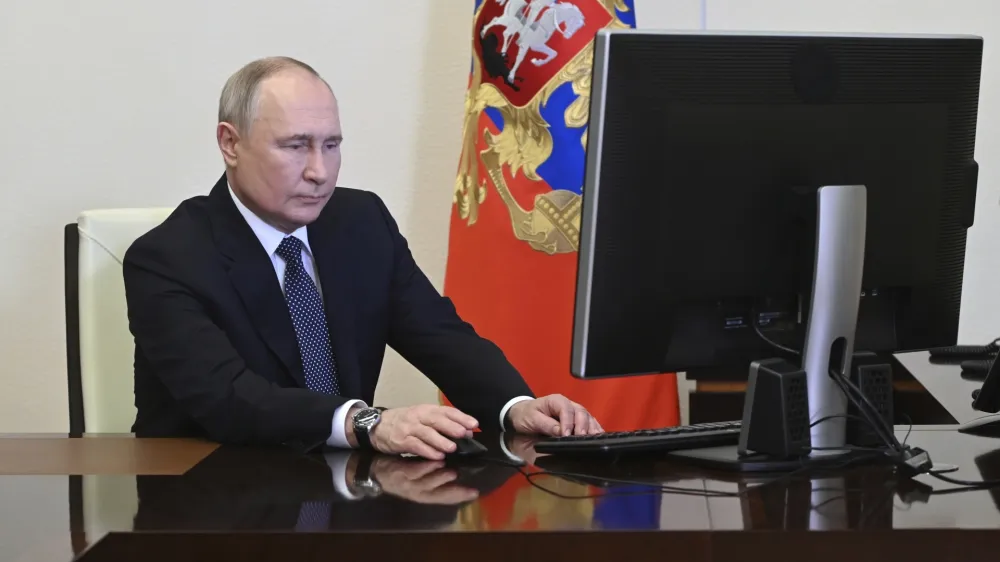 Russian President Vladimir Putin attends an electronic voting during a presidential voting at the Novo-Ogaryovo state residence outside Moscow, Russia, Friday, March 15, 2024. (Pavel Byrkin, Sputnik, Kremlin Pool Photo via AP)