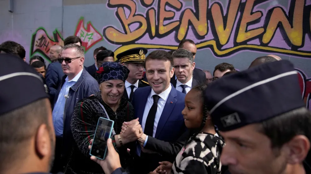 French President Emmanuel Macron meets residents during a visit focusing on security and the fight against drug trafficking, in La Castellane district of Marseille, southern France March 19, 2024.   Christophe Ena/Pool via REUTERS