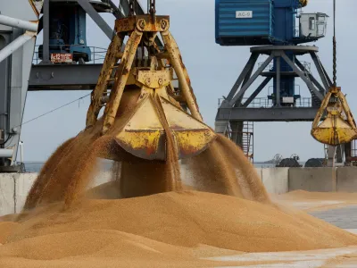 FILE PHOTO: A crane loads wheat grain into the cargo vessel Mezhdurechensk before its departure for the Russian city of Rostov-on-Don in the course of Russia-Ukraine conflict in the port of Mariupol, Russian-controlled Ukraine, October 25, 2023. REUTERS/Alexander Ermochenko/File Photo