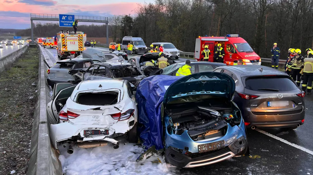 24 March 2024, Bavaria, Uettingen: A view of the scene of an accident involving some 40 vehicles near Wuerzburg, in Germany's Bavaria region, where two people were killed and 27 others were injured after a pile-up. Photo: Merzbach/News5/dpa - ACHTUNG: Kennzeichen wurde(n) aus rechtlichen Gr&uuml;nden gepixelt