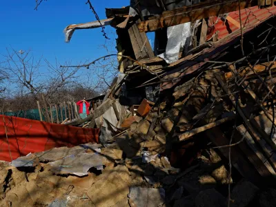 Local resident Svetlana stands on the ruins of her house, which was destroyed, according to Russian-installed authorities, by a Ukrainian military strike in the course of Russia-Ukraine conflict, in the town of Vuhlehirsk (Uglegorsk) in the Donetsk Region, Russian-controlled Ukraine, March 28, 2024. REUTERS/Alexander Ermochenko