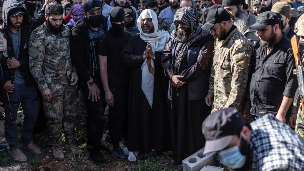 05 April 2024, Syria, Idlib: Syrians and members of Hay'at Tahrir al-Sham participate in the funeral of leader Maysar Al-Jubouri, who was killed as a result of an ISIS suicide bombing in his home in the city of Sarmada. Maysar Al-Jubouri, known as al-Qahtani, Iraqi national, one of the most prominent leaders of Hay'at Tahrir al-Sham. Photo: Anas Alkharboutli/dpa