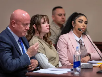 Hannah Gutierrez-Reed, the former armorer at the movie Rust, sits with her attorney Jason Bowles and paralegal Carmella Sisneros, during her sentencing hearing at First District Court, in Santa Fe, New Mexico, U.S., April 15, 2024. Eddie Moore/Pool via REUTERS