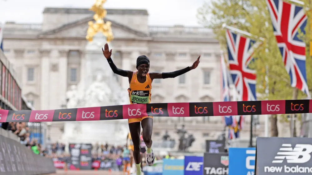 Peres Jepchirchir of Kenya is about to cross the finish line to win the women's race at the London Marathon in London, Sunday, April 21, 2024.(AP Photo/David Cliff)