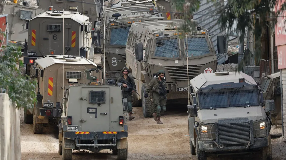 Israeli soldiers operate during a raid, at Nour Shams camp, in Tulkarm, in the Israeli-occupied West Bank, April 20, 2024. REUTERS/Raneen Sawafta