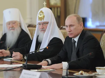 From right, Russian Prime Minister and presidential candidate Vladimir Putin, Russian Orthodox Patriarch Kirill and Metropolitan Yuvenaly of Krutitsa and Kolomna, during a meeting with Russia's religious leaders in the St. Daniel Monastery in Moscow, Wednesday, Feb. 8, 2012. (AP Photo/RIA-Novosti, Yana Lapikova, Government Press Service)