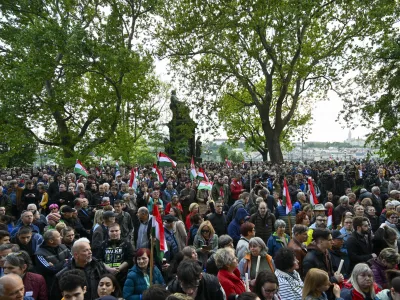 People protest outside the Hungarian Interior Ministry building to demand stronger protections for children and Interior minister Sandor Pinter to step down, in Budapest, Hungary, Friday, April 26, 2024. Peter Magyar, a former insider within Orban's ruling Fidesz party, lead a protest. The demonstration was the latest in a series of large anti-government protests that Magyar has mobilized in recent weeks, and comes as the political newcomer is campaigning for EU elections this June with his new party, Respect and Freedom (TISZA). (AP Photo/Denes Erdos)