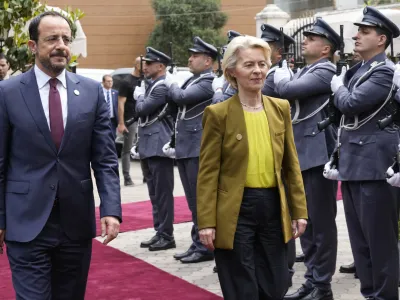 President of the European Commission Ursula von der Leyen, right, and Cyprus' President Nikos Christodoulides, left, review the honor guard upon their arrival for a meeting with Lebanese Parliament Speaker Nabih Berri, in Beirut, Thursday, May 2, 2024. The European Union announced Thursday a 1 billion euro aid package for Lebanon, much of which will go to strengthening border control to halt the flow of asylum seekers and migrants from the small, crisis-racked country across the Mediterranean sea to Cyprus and Italy. (AP Photo/Hussein Malla)
