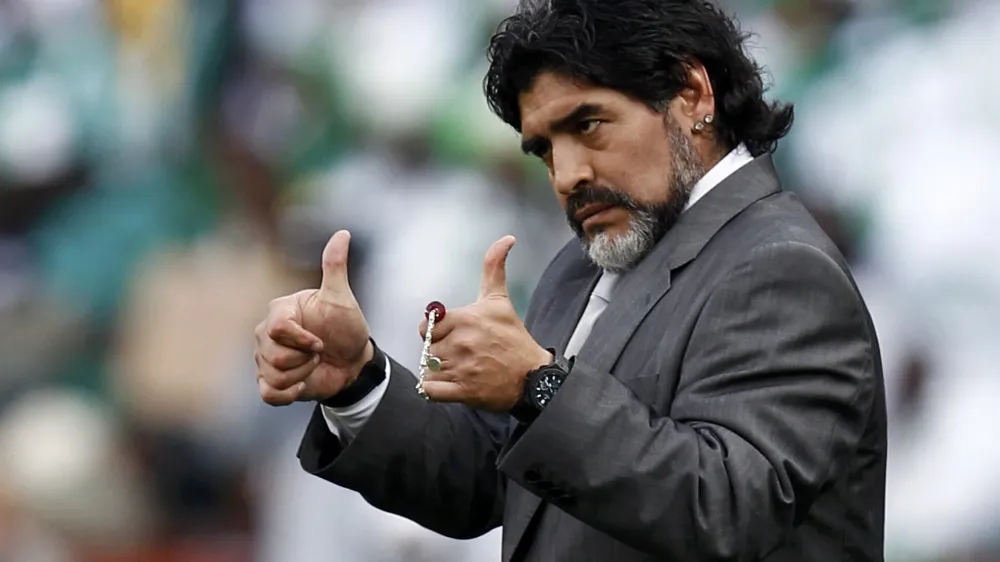 Argentina's coach Diego Maradona gives the thumbs-up during a 2010 World Cup Group B soccer match against Nigeria at Ellis Park stadium in Johannesburg June 12, 2010. REUTERS/Eddie Keogh (SOUTH AFRICA - Tags: SPORT SOCCER WORLD CUP)