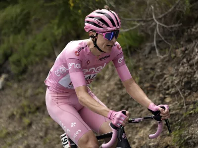 Slovenia's Tadej Pogacar, wearing the pink jersey of the race overall leader, pedals during the fifth stage of the of the Giro d'Italia, Tour of Italy cycling race, from Genoa to Lucca, Wednesday, May 8, 2024. (Fabio Ferrari/LaPresse via AP)