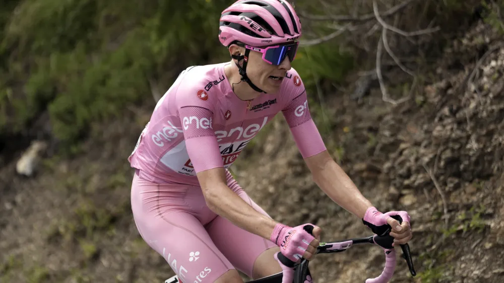 Slovenia's Tadej Pogacar, wearing the pink jersey of the race overall leader, pedals during the fifth stage of the of the Giro d'Italia, Tour of Italy cycling race, from Genoa to Lucca, Wednesday, May 8, 2024. (Fabio Ferrari/LaPresse via AP)