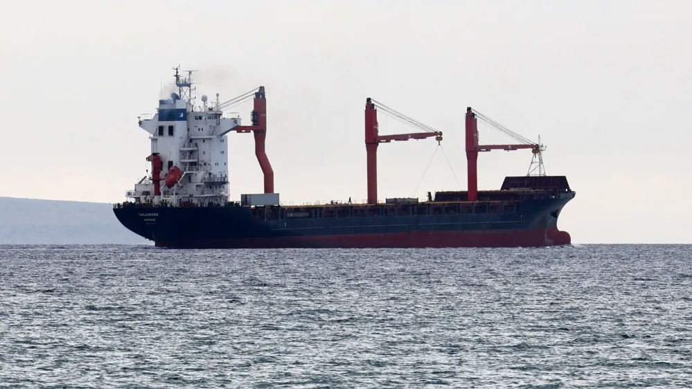 A person is seen on board as a U.S. flagged cargo vessel carrying aid to a pier built by the U.S. off Gaza sets sail from Larnaca, Cyprus May 9, 2024. REUTERS/Yiannis Kourtoglou
