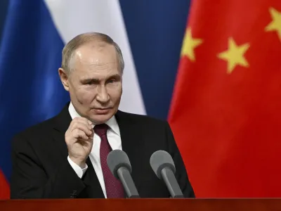 Russian President Vladimir Putin gestures as he talks with students of the Harbin Institute of Technology in Harbin, northeastern China's Heilongjiang Province, on Friday, May 17, 2024. (Sergei Guneyev, Sputnik, Kremlin Pool Photo via AP)