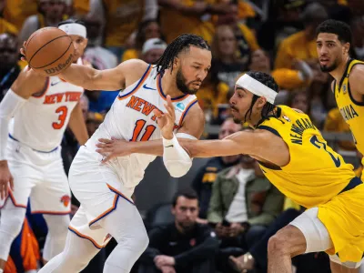 May 17, 2024; Indianapolis, Indiana, USA; New York Knicks guard Jalen Brunson (11) dribbles the ball while Indiana Pacers guard Andrew Nembhard (2) defends during game six of the second round for the 2024 NBA playoffs at Gainbridge Fieldhouse. Mandatory Credit: Trevor Ruszkowski-USA TODAY Sports