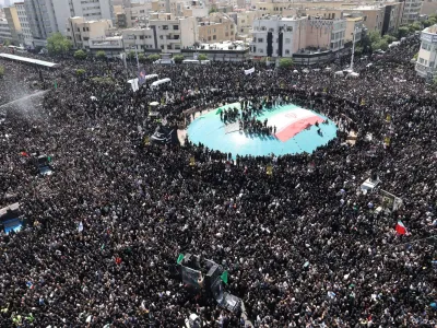 Mourners attend a funeral for victims of the helicopter crash that killed Iran's President Ebrahim Raisi, Foreign Minister Hossein Amirabdollahian and others, in Tehran, Iran, May 22, 2024. Majid Asgaripour/WANA (West Asia News Agency) via REUTERS ATTENTION EDITORS - THIS PICTURE WAS PROVIDED BY A THIRD PARTY