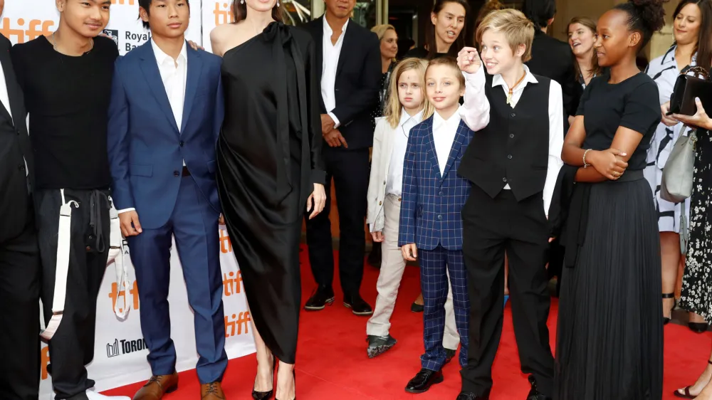 FILE PHOTO: Director Angelina Jolie arrives on the red carpet with her six children (L-R) Maddox Jolie-Pitt, Pax Jolie-Pitt, Vivienne Jolie-Pitt, Knox Leon Jolie-Pitt, Shiloh Jolie-Pitt, and Zahara Jolie-Pitt for the film "First They Killed My Father" at the Toronto International Film Festival (TIFF), in Toronto, Ontario, Canada, September 11, 2017.  REUTERS/Mark Blinch/File Photo